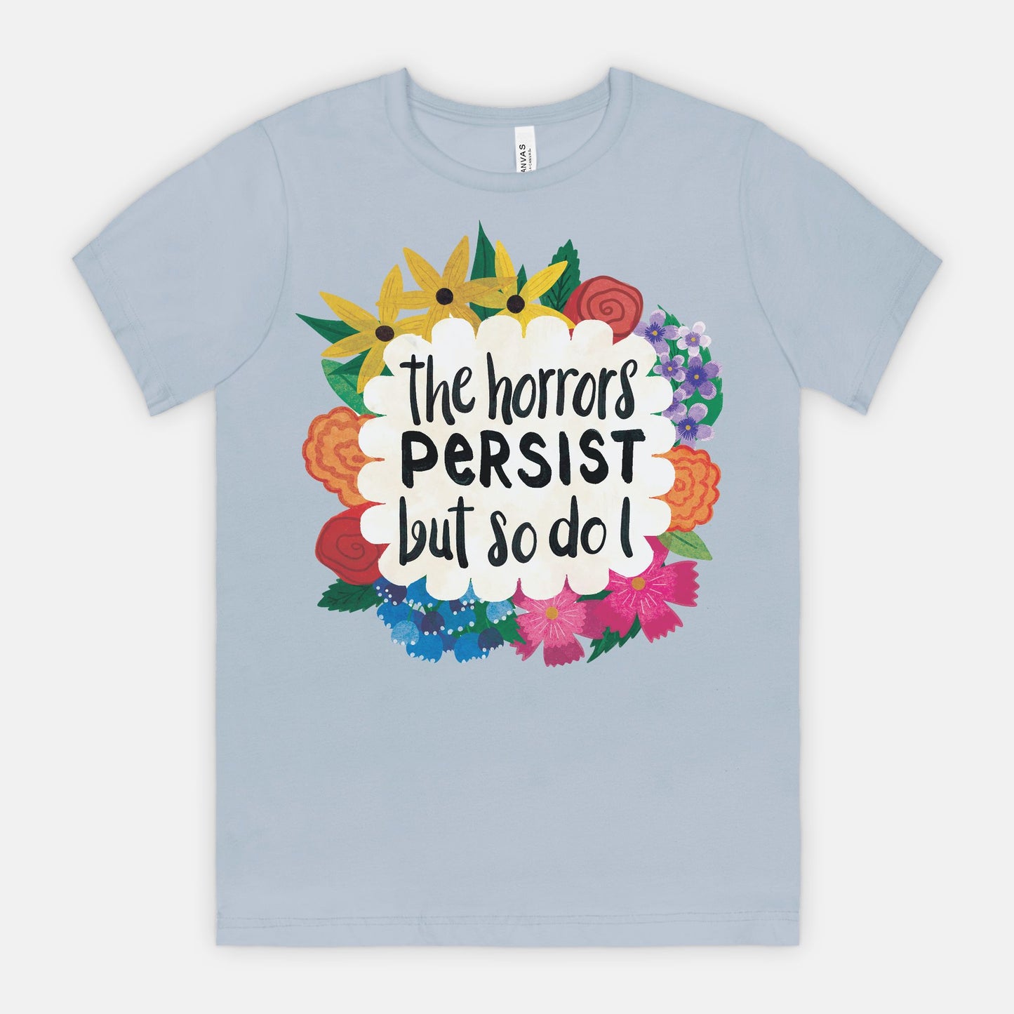 Light blue t-shirt with colorful floral design and text on a white background