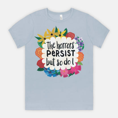 Light blue t-shirt with colorful floral design and text on a white background