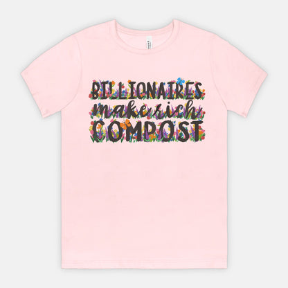 Pink t-shirt with colorful text on a light gray background