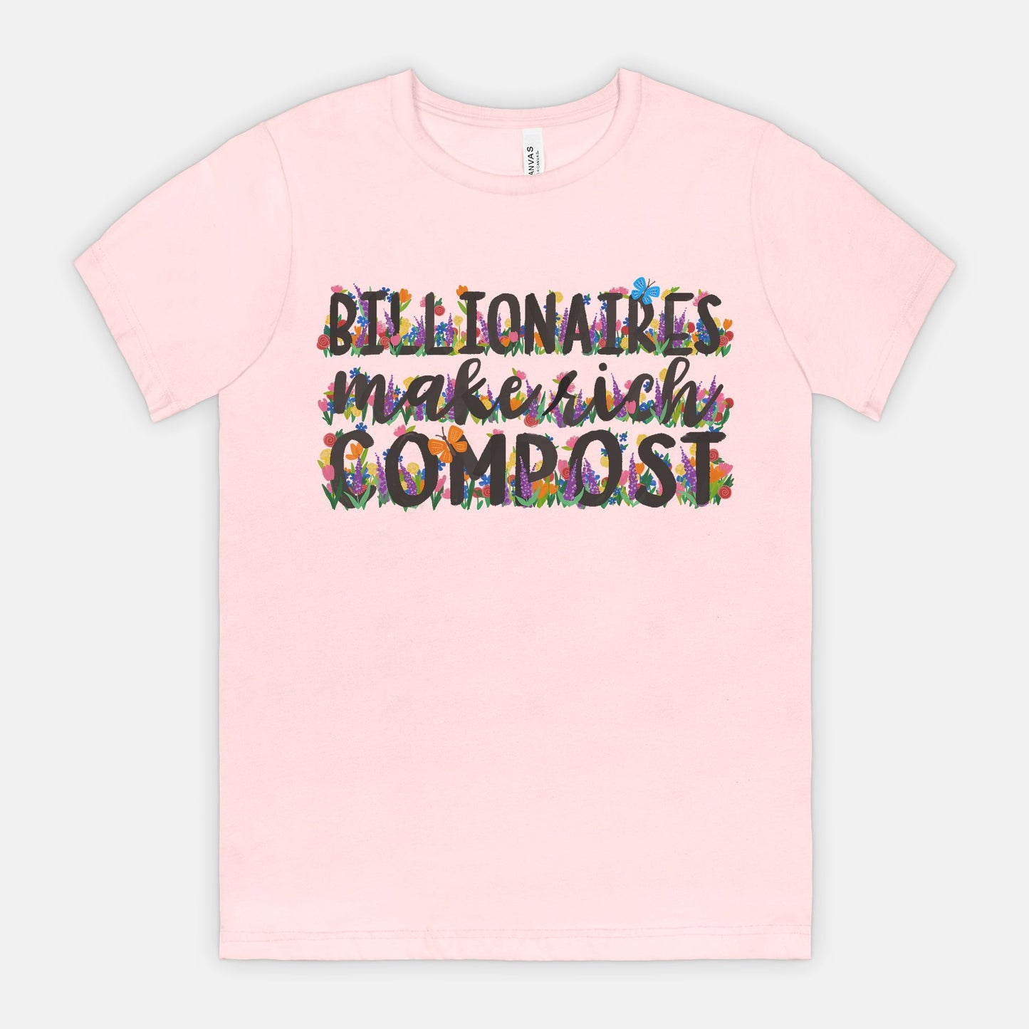 Pink t-shirt with colorful text on a light gray background