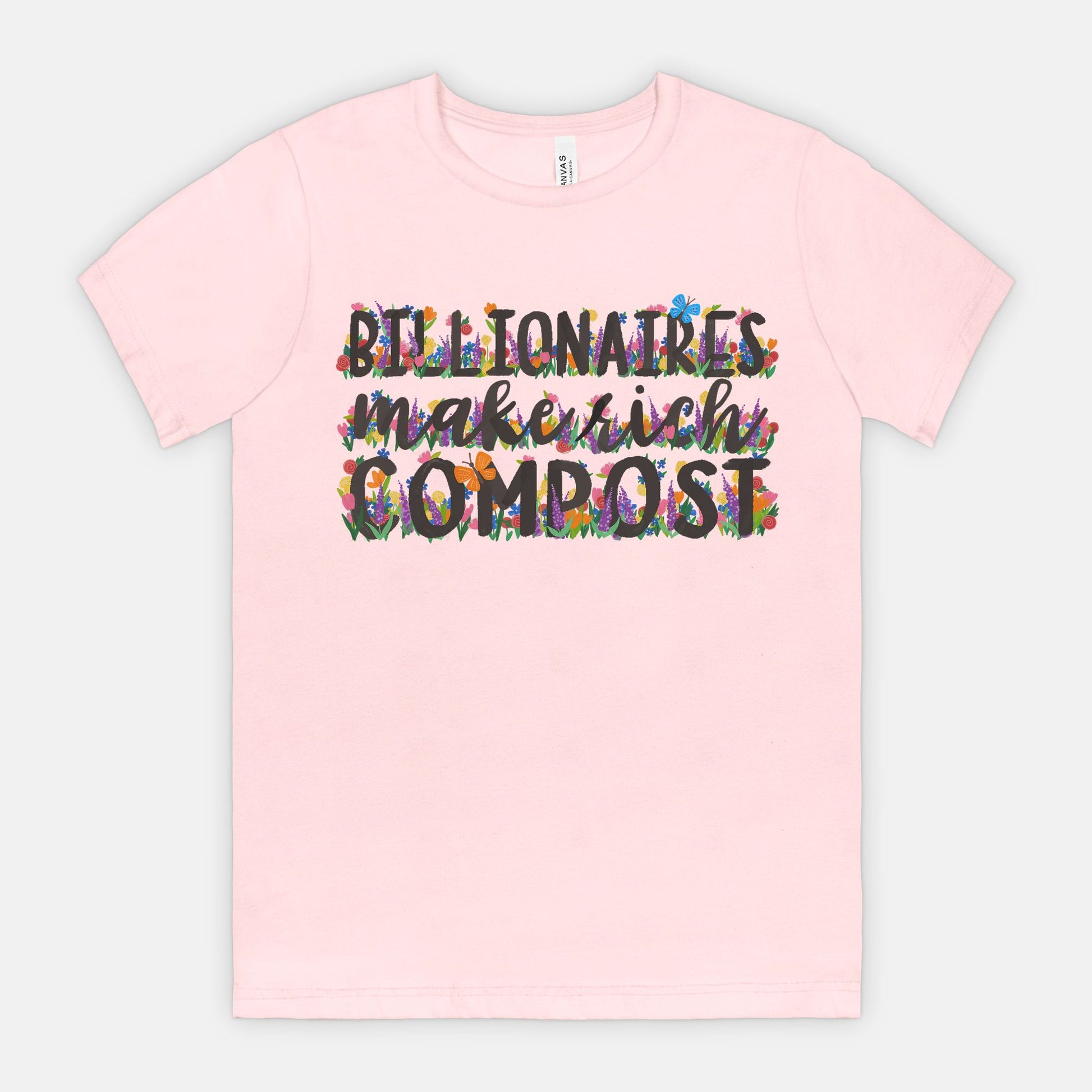 Pink t-shirt with colorful text on a light gray background