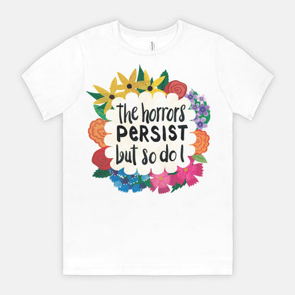 White t-shirt with colorful floral design and text on a white background